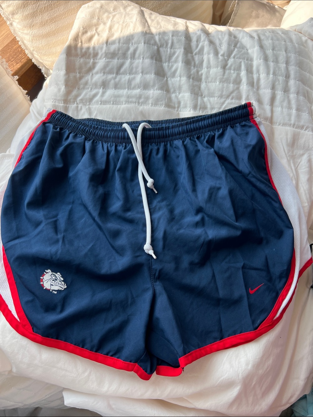 Nike Women's Navy Athletic Shorts with Red Trim and White Drawcord